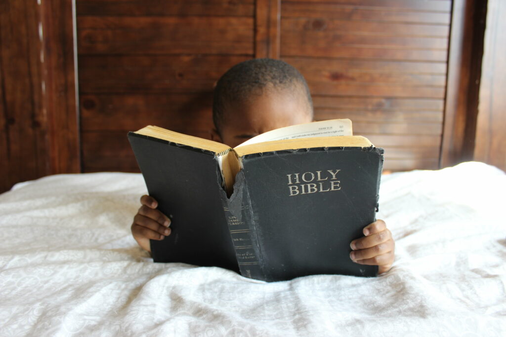 A child reading the Bible