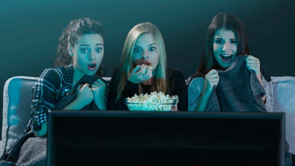 How Much Average Screen Time is Good for Teens? A Curation 35 Heroes: Girls eating popcorn while watching television